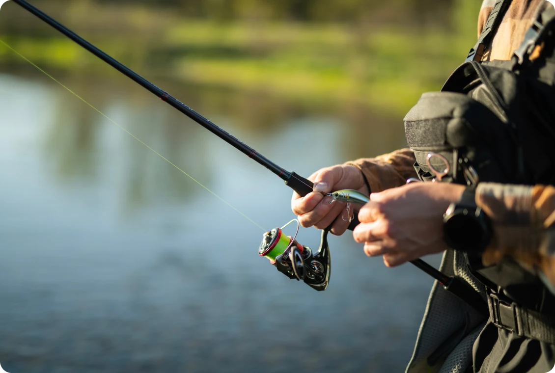 Close-up of fishing reel and rod
