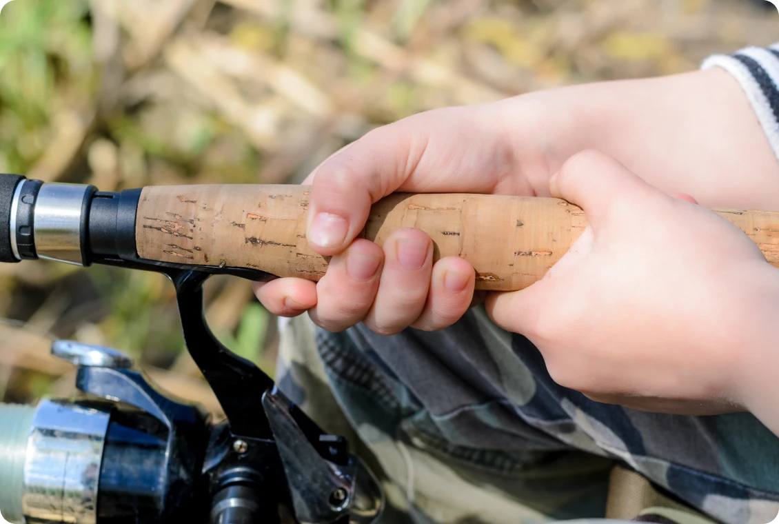 Child holding a fishing rod